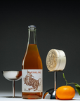 Meinklang Weißer Mulatschak orange natural wine from Burgenland Austria bottle with citrus and cheese styling for Mysa Natural Wine