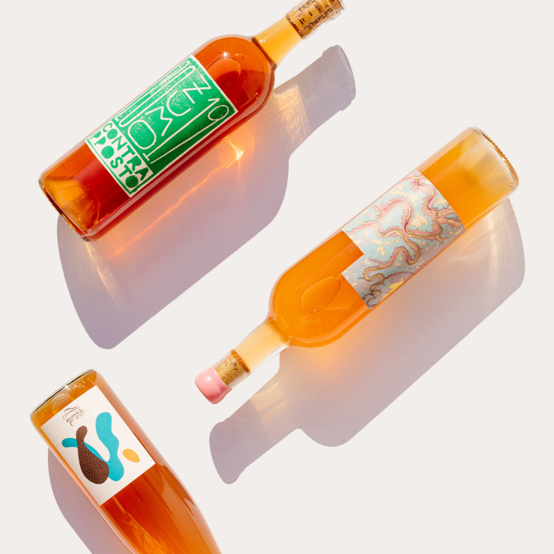 natural orange wine bottles lying down eros les vins pirouettes alsace france