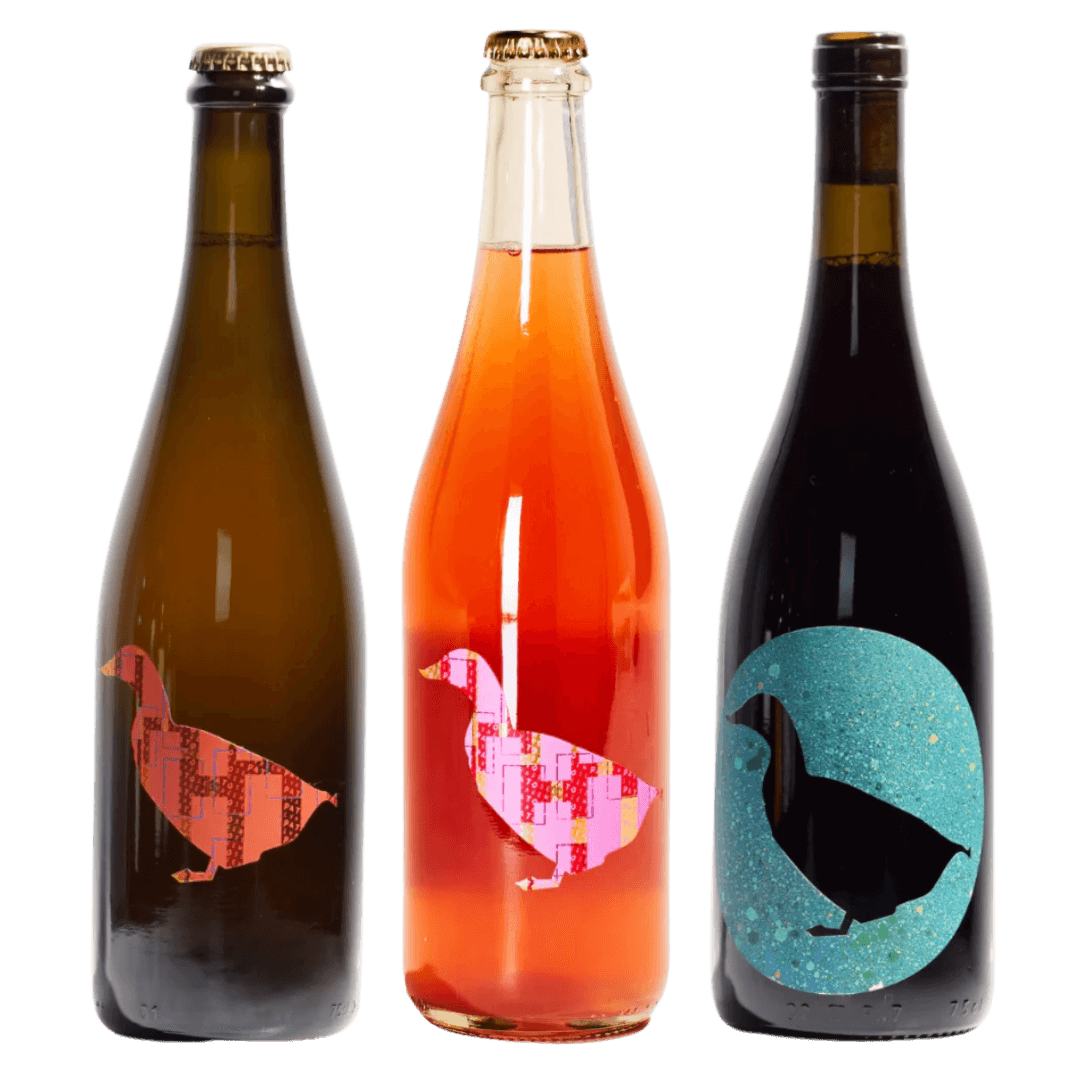 Three bottles with duck illustrations on a black background from portugal