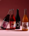 Meinklang natural wine collection including Mulatschak red, Prosa rosé, and white wines from Austria on pink background for Mysa Natural Wine